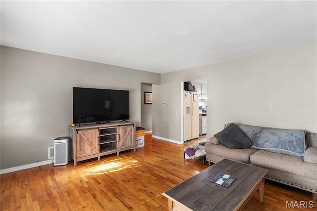 432 N 9th St, Mascoutah, IL 62258 - living room with light wood finished floors and baseboards