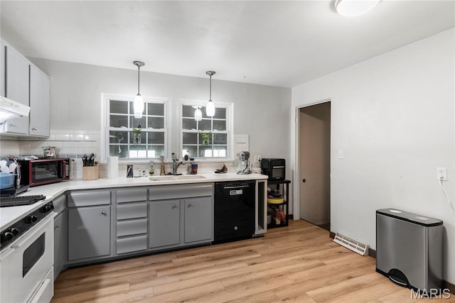 432 N 9th St, Mascoutah, IL 62258 - kitchen with white gas range oven, dishwasher, gray cabinetry, tasteful backsplash, and light countertops