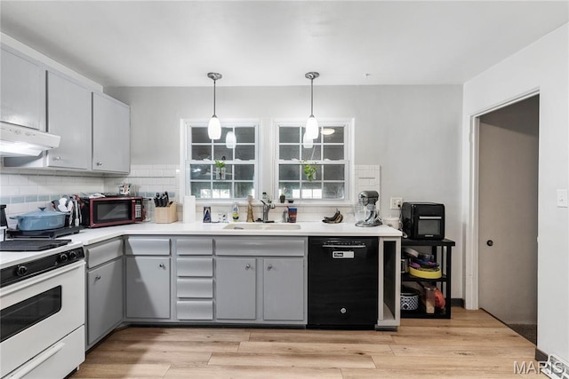 432 N 9th St, Mascoutah, IL 62258 - kitchen featuring gas range gas stove, black dishwasher, decorative backsplash, extractor fan, and gray cabinets