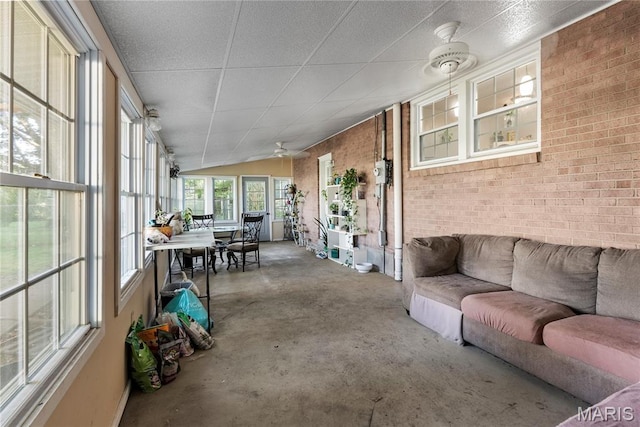 432 N 9th St, Mascoutah, IL 62258 - sunroom / solarium with concrete flooring, brick wall, outdoor dining area, and outdoor lounge area