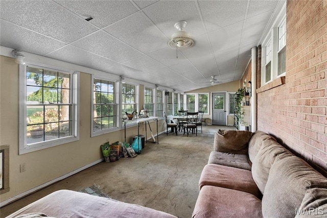 432 N 9th St, Mascoutah, IL 62258 - sunroom / solarium with lofted ceiling, concrete flooring, and brick wall