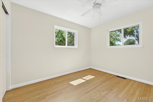265 Francisca Dr, Florissant, MO 63031 - unfurnished room with plenty of natural light, light wood-style floors, and ceiling fan