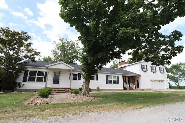 1001 E 2nd St, Saint Peter, IL 62880 - view of front of house with a garage and a front yard