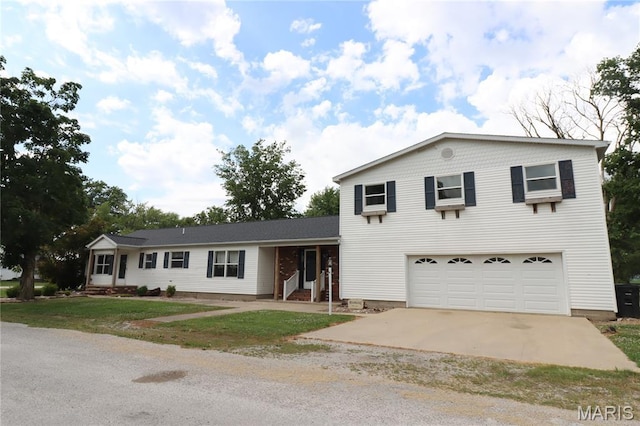 1001 E 2nd St, Saint Peter, IL 62880 - view of front of house with concrete driveway, an attached garage, and a front lawn