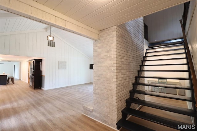 1001 E 2nd St, Saint Peter, IL 62880 - stairway with wood finished floors, brick wall, wooden walls, and wood ceiling
