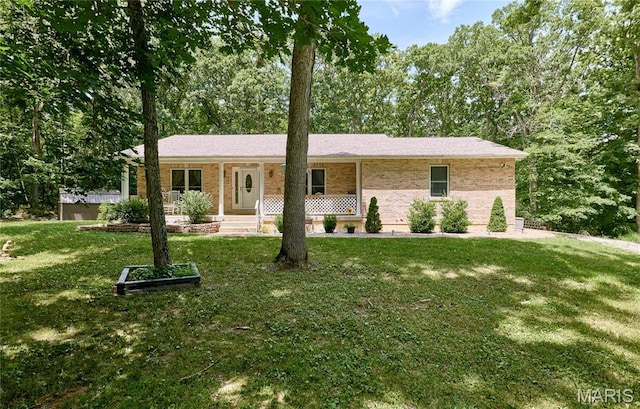 1939 N Rock Church Rd, Troy, MO 63379 - single story home with a porch, a front lawn, and brick siding