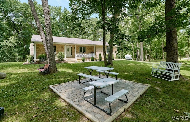 1939 N Rock Church Rd, Troy, MO 63379 - view of home's community with a lawn, a patio area, and view of wooded area