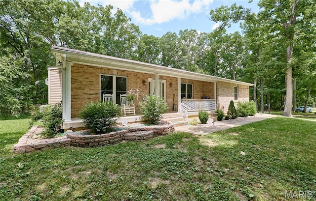 1939 N Rock Church Rd, Troy, MO 63379 - single story home featuring a porch, brick siding, and a front yard