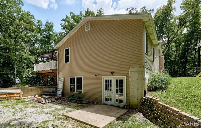 1939 N Rock Church Rd, Troy, MO 63379 - back of house featuring french doors, a wooden deck, and a lawn