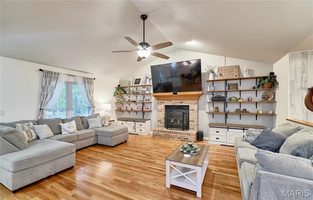 1939 N Rock Church Rd, Troy, MO 63379 - living room featuring a ceiling fan, wood finished floors, lofted ceiling, and a fireplace