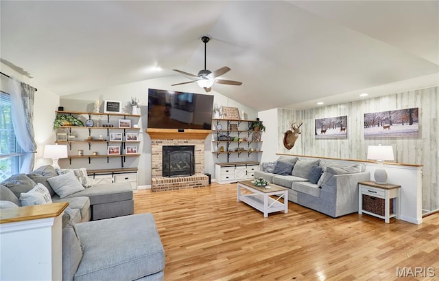 1939 N Rock Church Rd, Troy, MO 63379 - living area with a ceiling fan, light wood-style floors, lofted ceiling, and a fireplace