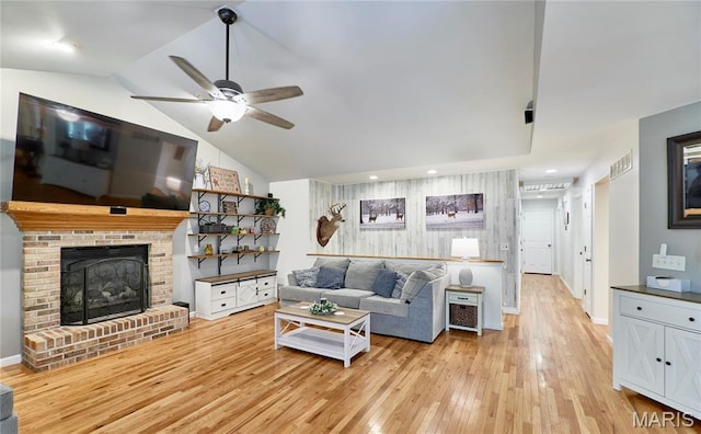 1939 N Rock Church Rd, Troy, MO 63379 - living area with light wood-style floors, a ceiling fan, vaulted ceiling, a brick fireplace, and recessed lighting