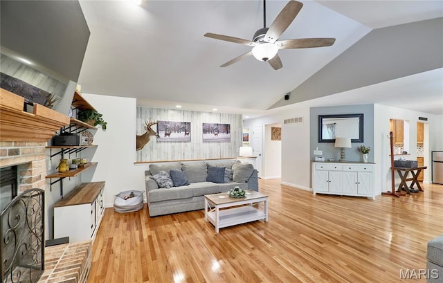 1939 N Rock Church Rd, Troy, MO 63379 - living area featuring ceiling fan, light wood-style floors, a brick fireplace, high vaulted ceiling, and recessed lighting