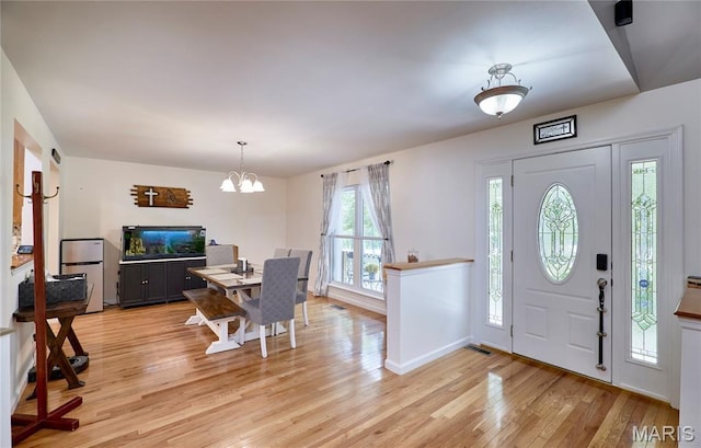 1939 N Rock Church Rd, Troy, MO 63379 - entryway with light wood-style flooring and a chandelier