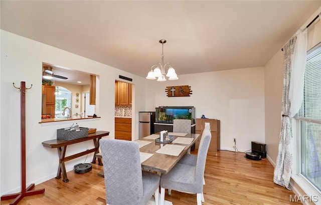 1939 N Rock Church Rd, Troy, MO 63379 - dining room featuring a chandelier and light wood-style flooring