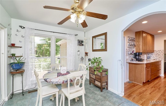 1939 N Rock Church Rd, Troy, MO 63379 - dining area with arched walkways, a ceiling fan, and recessed lighting
