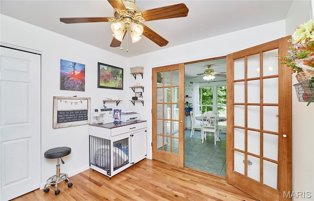 1939 N Rock Church Rd, Troy, MO 63379 - home office featuring light wood-style flooring, a ceiling fan, and french doors