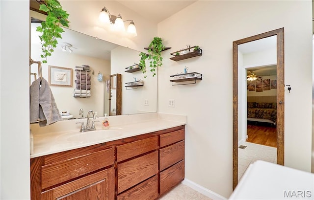 1939 N Rock Church Rd, Troy, MO 63379 - ensuite bathroom featuring vanity, ceiling fan, and tile patterned flooring