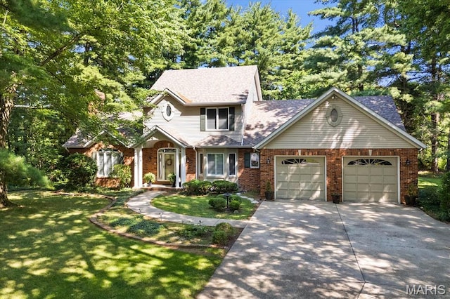 4 Cheshire Ct, Edwardsville, IL 62025 - view of front of home with driveway, a garage, brick siding, and a front yard