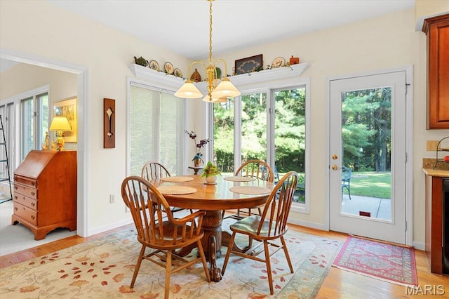 4 Cheshire Ct, Edwardsville, IL 62025 - dining room featuring plenty of natural light, a chandelier, and light wood-style flooring