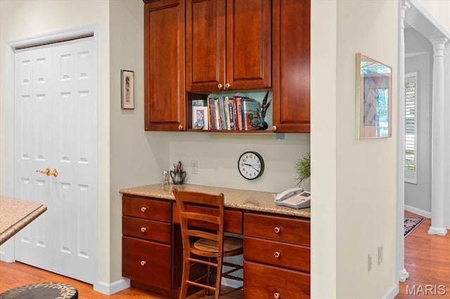 4 Cheshire Ct, Edwardsville, IL 62025 - home office featuring light wood-style floors and built in study area