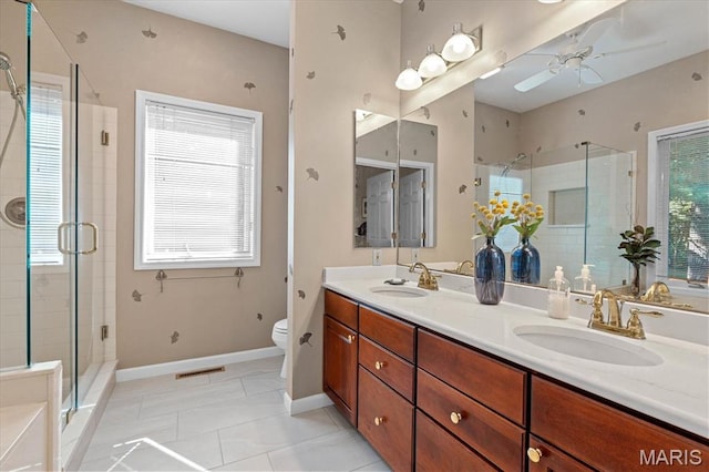 4 Cheshire Ct, Edwardsville, IL 62025 - bathroom featuring a shower stall, double vanity, a ceiling fan, and tile patterned flooring