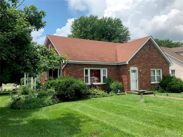 103 Maupin Ave, New Haven, MO 63068 - view of front of home featuring brick siding, a front lawn, and a shingled roof