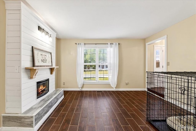 219 Royalltrail Ln, Saint Charles, MO 63368 - unfurnished living room with wood finished floors and a large fireplace