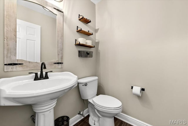 219 Royalltrail Ln, Saint Charles, MO 63368 - half bathroom with wood finished floors and toilet