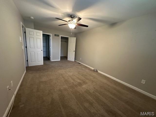 12750 Needle Point Ct, Florissant, MO 63033 - unfurnished bedroom featuring dark colored carpet and ceiling fan