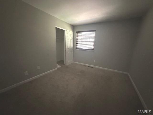 12750 Needle Point Ct, Florissant, MO 63033 - unfurnished bedroom featuring light colored carpet and a closet