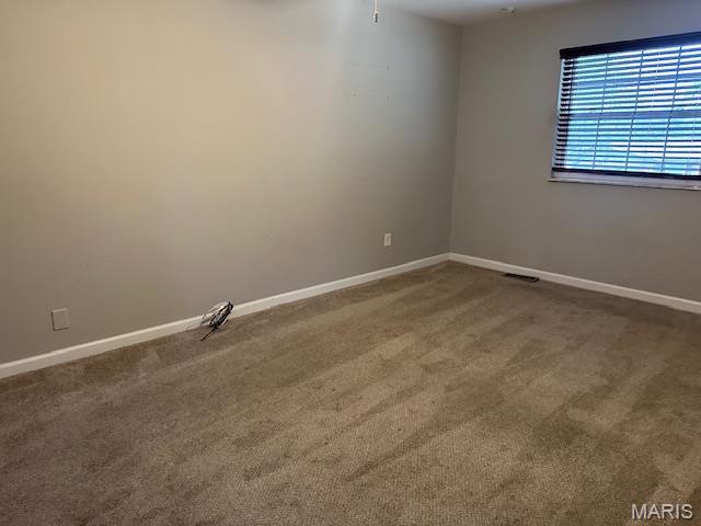 12750 Needle Point Ct, Florissant, MO 63033 - spare room featuring baseboards and carpet floors