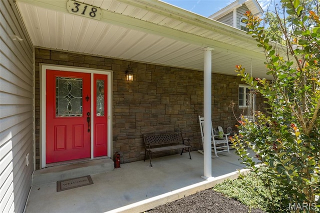 318 Doe Run Ln, Bonne Terre, MO 63628 - property entrance featuring stone siding and covered porch