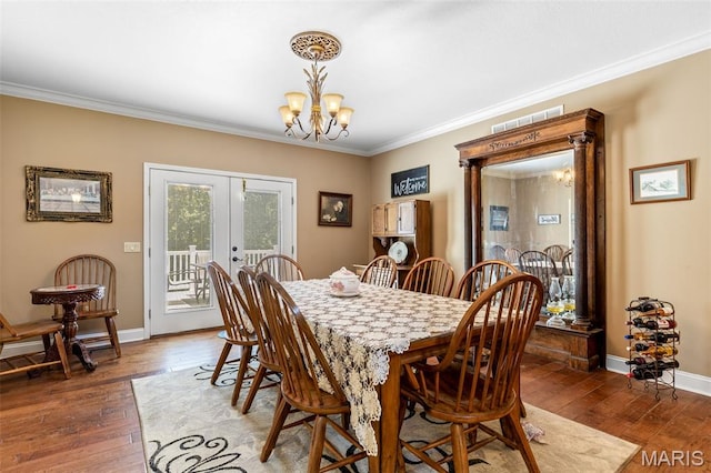 318 Doe Run Ln, Bonne Terre, MO 63628 - dining space with a chandelier, french doors, crown molding, and hardwood / wood-style flooring