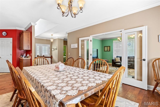 318 Doe Run Ln, Bonne Terre, MO 63628 - dining room with a chandelier, french doors, ornamental molding, and plenty of natural light