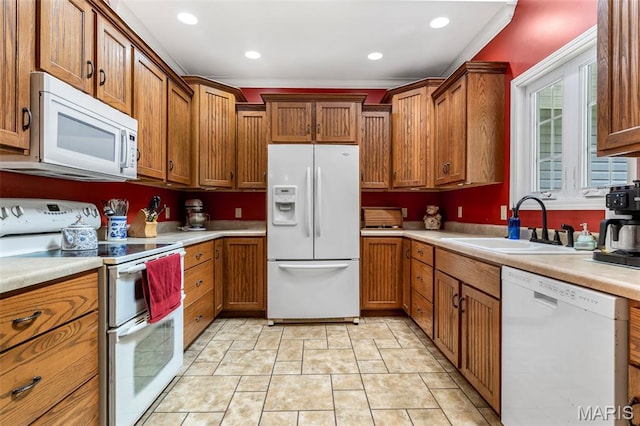318 Doe Run Ln, Bonne Terre, MO 63628 - kitchen with white appliances, light countertops, brown cabinetry, and recessed lighting