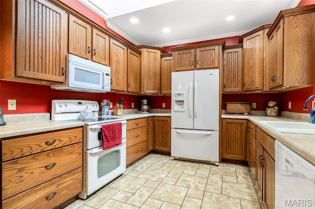 318 Doe Run Ln, Bonne Terre, MO 63628 - kitchen with white appliances, brown cabinetry, light countertops, and recessed lighting