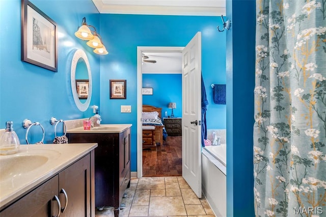 318 Doe Run Ln, Bonne Terre, MO 63628 - full bath with connected bathroom, two vanities, crown molding, a tub, and tile patterned flooring