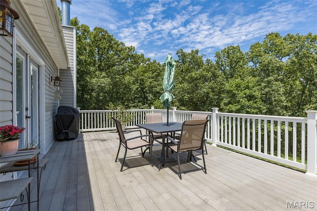 318 Doe Run Ln, Bonne Terre, MO 63628 - deck featuring outdoor dining space, grilling area, and view of wooded area