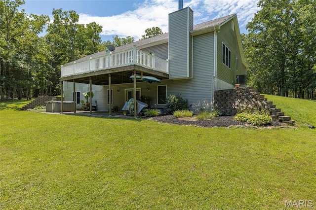 318 Doe Run Ln, Bonne Terre, MO 63628 - back of house featuring an outdoor hot tub, a wooden deck, a yard, a chimney, and a patio