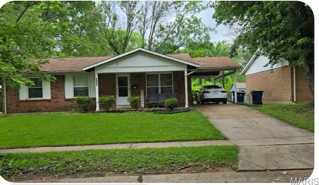 2106 Kingsford Dr, Florissant, MO 63031 - ranch-style house featuring driveway, a front lawn, brick siding, and an attached carport