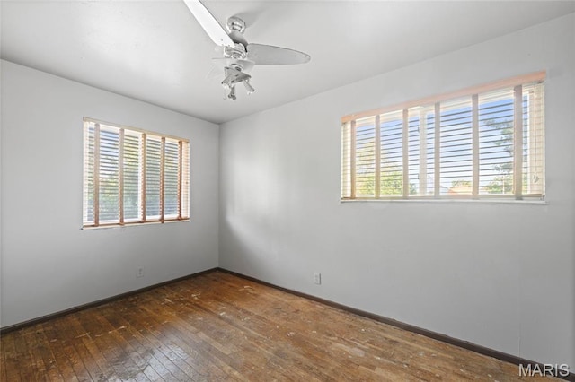 2239 University St, Saint Louis, MO 63107 - spare room with a ceiling fan and wood-type flooring