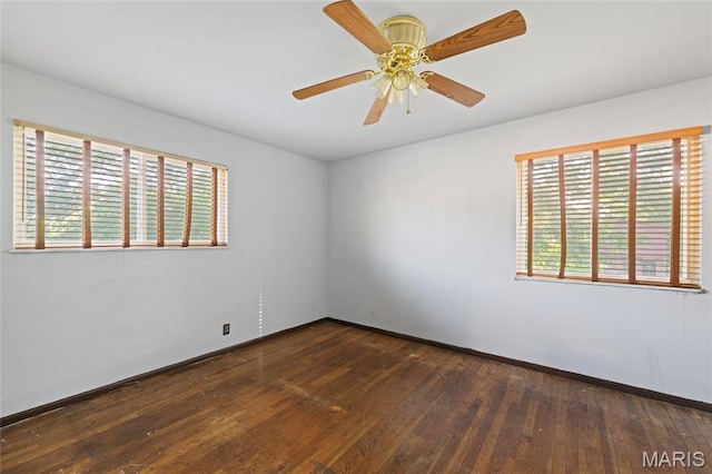 2239 University St, Saint Louis, MO 63107 - empty room featuring plenty of natural light, hardwood / wood-style floors, and a ceiling fan