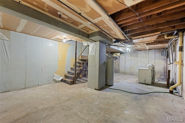 2239 University St, Saint Louis, MO 63107 - unfinished basement with stairway, water heater, and heating unit