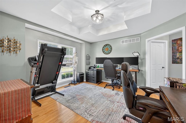156 Bluffview Dr, Troy, MO 63379 - office with a raised ceiling, wood finished floors, and a chandelier