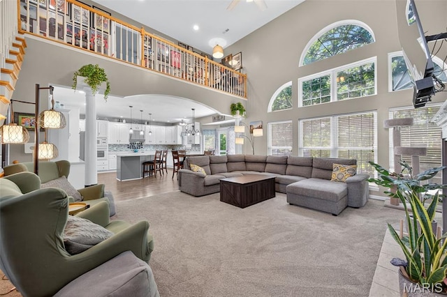 156 Bluffview Dr, Troy, MO 63379 - living room featuring a high ceiling, plenty of natural light, recessed lighting, and a chandelier