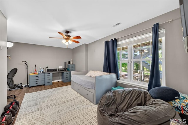 156 Bluffview Dr, Troy, MO 63379 - bedroom with wood finished floors, ceiling fan, and an office area