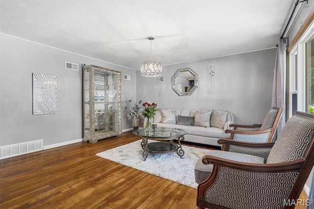 1326 Petite Dr, Saint Louis, MO 63138 - living room with wood finished floors and a chandelier