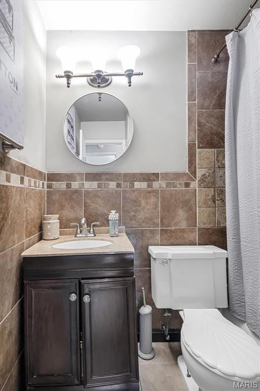 1326 Petite Dr, Saint Louis, MO 63138 - bathroom featuring vanity, tile walls, and curtained shower
