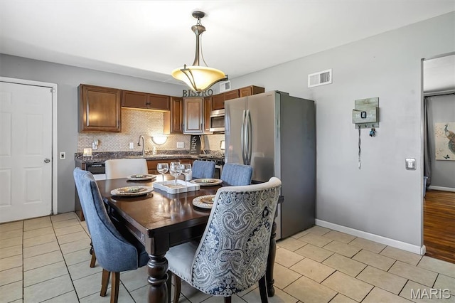 1326 Petite Dr, Saint Louis, MO 63138 - dining room featuring light tile patterned flooring